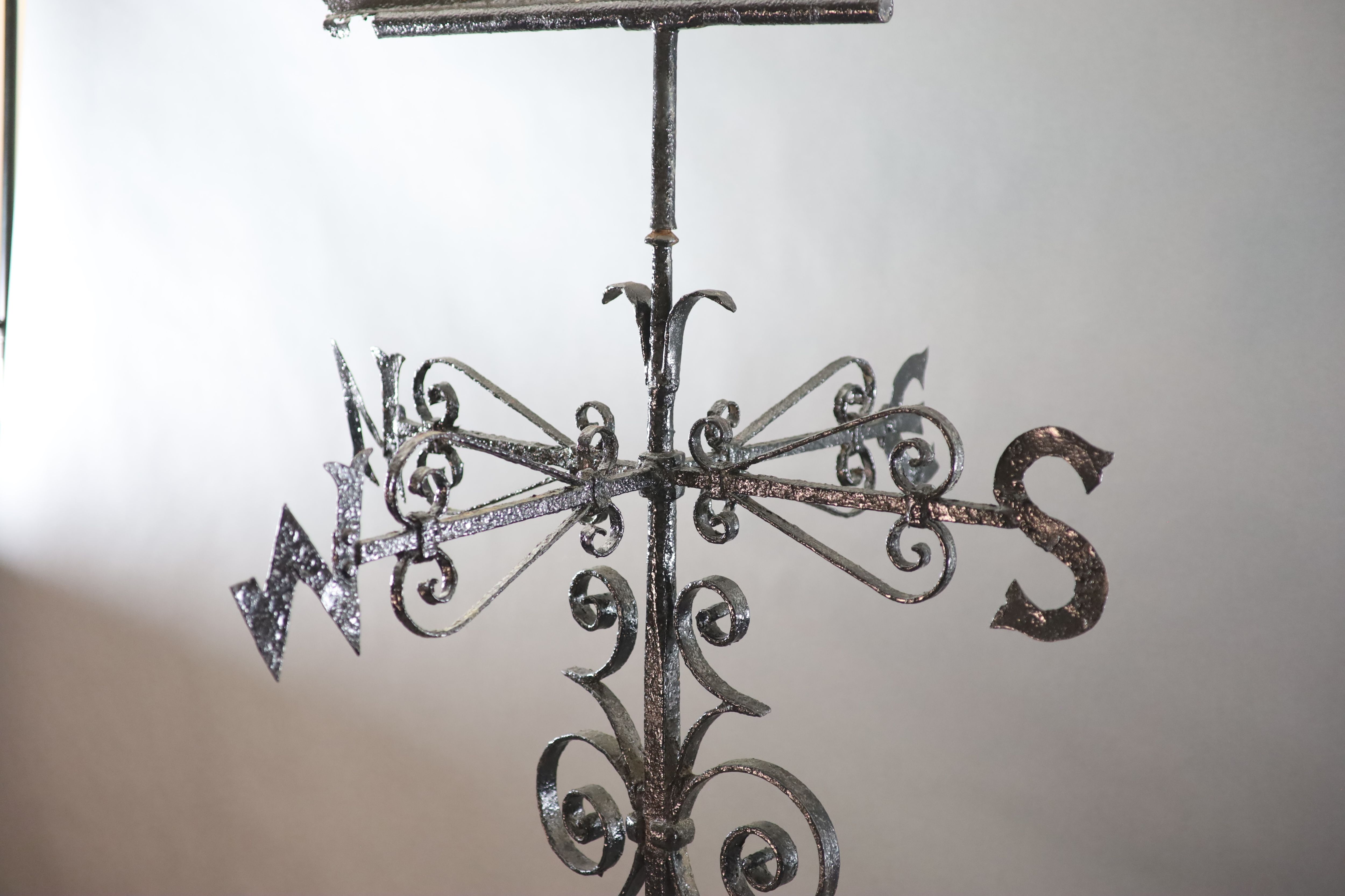 A large Victorian black painted wrought iron weather vane, H.8ft 4in.